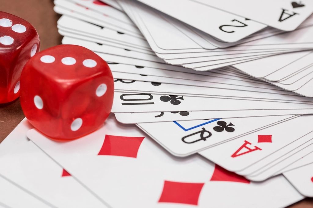 Gaming chips and cards on the table felt